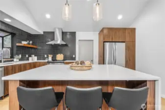 Gorgeous kitchen with custom cabinets, quartz, designer tile and SS appliances
