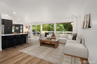 Inviting family room with engineered flooring throughout much of main home