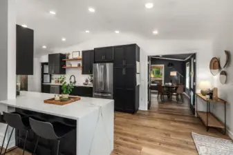 Open layout integrates the family room and kitchen while offering additional seating at the breakfast bar