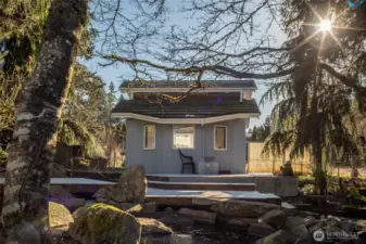Shed being used as a chicken coop. Also has a man-made waterfall.