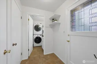 This area, just outside kitchen area you'll find 3/4 bath with laundry, entrance to upstairs bedroom, entrance to secondary living room and door to back yard.  Great place for brooms, coats, shoes (AKA Mud room).