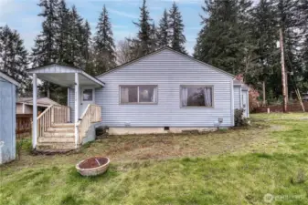 Back entrance to the home.  Bring your tool belt and build instant equity in this home.