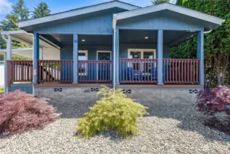 Welcome to your new home, featuring a charming and expansive covered front porch, perfect for relaxing year-round.