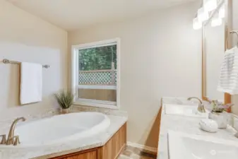 Relax and unwind in the modern soaking tub, a perfect retreat after a long day.