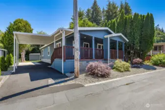 Keep your vehicle protected from the elements with the convenient carport, providing both shelter and additional driveway parking.