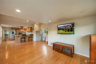 Great room flowing into living space - plenty of room for your biggest furniture. Note the bamboo flooring thru out the rooms.