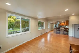 Windows continue down the length of the home, looking out over the expansive deck and pastural setting