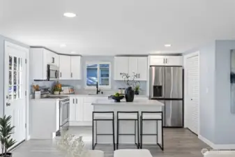 Enough space for a small dining table or keep the open space and slide up to the spacious island to gather and enjoy meals, drinks and never leave the cook out of the conversation.  All new stainless steel appliances were added and stay with the home.