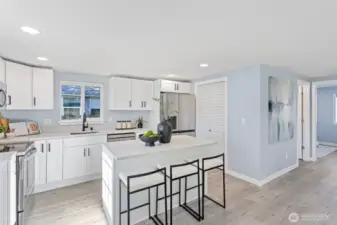 loads of storage space in the soft close cabinets with eye catching hardware and let's not miss the gorgeous quartz countertops.