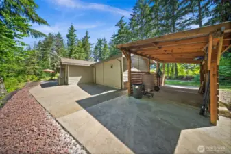Carport offers a covered patio enjoyment space