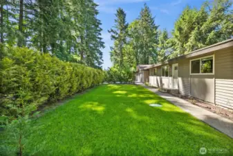 Well manicured front yard designed for privacy
