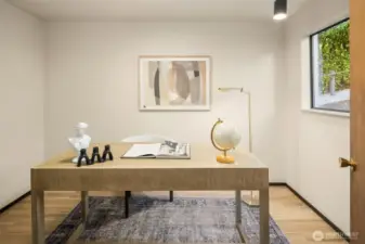 Versatile area currently staged as a den, it also could be used as a large pantry or small bedroom.