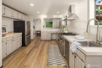 The kitchen flows into the eating area which opens onto the back deck.
