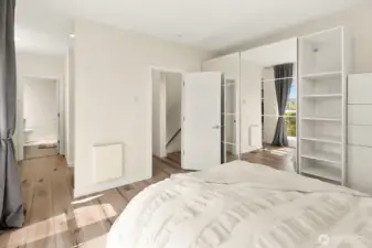 Primary bedroom with mirrored storage closet