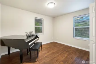 first bedroom on the left. Piano has been removed