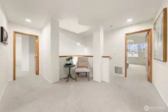 A wide upstairs landing creates a natural transition between bedrooms while offering open sightlines to the lower level. The layout provides flexibility for a reading nook or display space without interrupting flow.