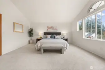 Welcome to the Primary Suite, where vaulted ceilings and a striking arched window fills the space with natural light, creating a serene and inviting retreat. With no shared walls, this suite offers added privacy, and brand-new carpet adds a fresh, comfortable finish.