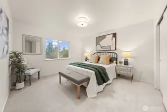 Bedroom 4 offers a bright and comfortable layout with soft carpet and a well-sized window that brings in natural light and treetop views.