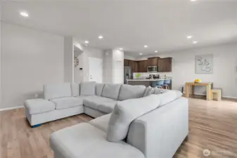 Walking down the hall, you will love the gorgeous flooring, and open concept layout from kitchen to family room. Door to your garage and pantry straight ahead.