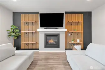 Shot of your BEAUTIFUL gas fireplace, keeps you cozy on cooler nights but so nice to look at year-round! I love the decor, mantle and floating shelves.