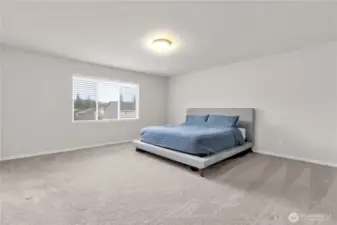 Upstairs you will find all bedrooms including this massive primary suite!