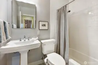 In between this bathroom and the bedroom is an extra large closet for clothes and storage items.