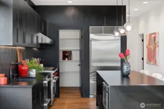 High end wolf range and leather absolute black granite countertops.