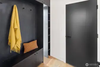 Mud room at entrance to home from the garage