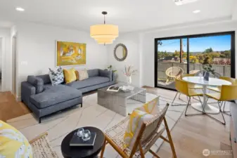 This is the lower level living space with a living room, dining area, full kitchen and slider to an entertainment sized deck and level, fully-fenced backyard.