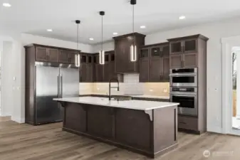 Huntwood soft close cabinets with pull out lower shelves.