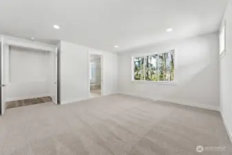 Large primary suite that looks out to the trees