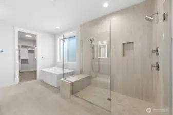 Spa like primary bath with heated floors, soaking tub, and massive walk-in shower