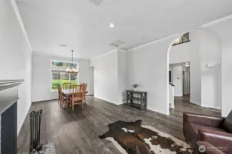 Through the arched entry from the foyer the formal living and dining rooms offer additional space for entertaining.