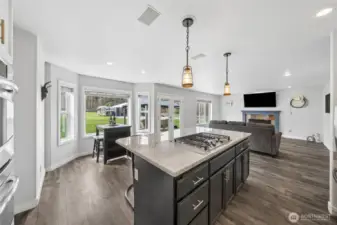 The open-concept family room and kitchen create a bright, airy space filled with abundant natural light—perfect for both everyday living and entertaining.