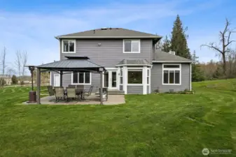 Rear view of the house with flat level ground to play.