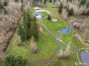 Good ariel view of the property lines, long driveway, seasonal pond, pastures, round pen & barn.