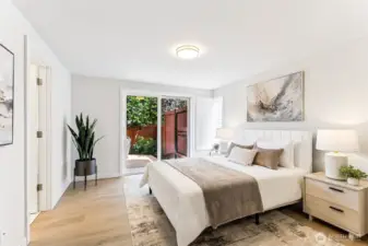 Primary suite features sliders to private patio, spacious walk-in and en-suite bath...