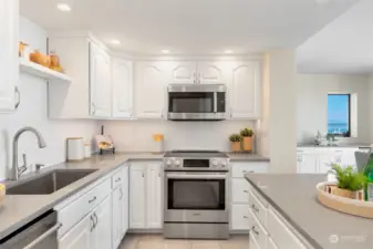 Remodeled kitchen and bathrooms, including opening wall with added breakfast nook and new buffet with added window and wine fridge.