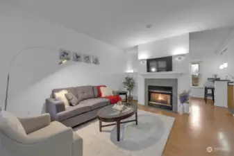 Open concept living with Central AC, gas fireplace and fresh paint throughout