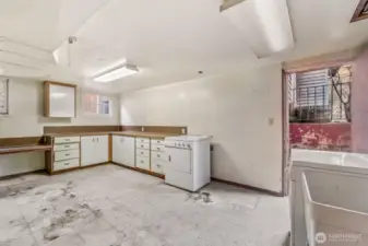 Utility room has separate exterior door.  Not shown in photo is oil furnace that was never used by sellers. The previous owners added the electric baseboard heaters throughout the home.