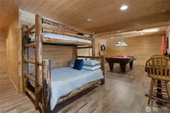 The rec room in the daylight basement has enough extra space for extra sleeping space. New Luxury Vinyl Plank floors down here!