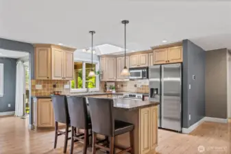 Even the kitchen sink offers views of the sunsets and Sound, making evening clean-up more enjoyable. The skylight further enhances the space by introducing more natural light into the great room.