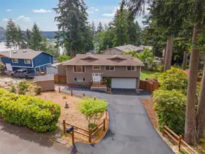 This home underwent major updates in 2017, including a new roof, vinyl windows, and many interior updates. The current owners have further enhanced the property by removing trees, installing new fencing, upgrading the electrical panel, recent new carpet and pad, and adding a two-step water filtration system. The revitalized landscaping is also designed for easy maintenance.