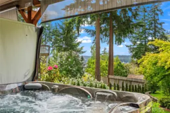 This six-person hot tub is a winter evening's dream, and a lovely addition for year-round use. It's easy to maintain and provides views of the peaceful, lush, and terraced back yard. There are pull down the screens for more privacy too.