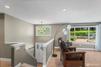 The sunlit entryway warmly invites guests into the great room. The previous updates included hardwood floors, upgraded trim and molding, and solid-core wood doors.