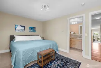 The private 3/4 bath in the Primary BR has heated tile floors, dual vanity sinks, and a full-length shower.