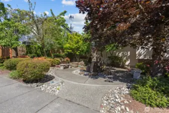 There is easy to find off-street parking for your guests when they come to visit!  There is also this great little spot to sit while you are enjoying being outside.
