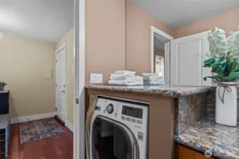 Directly across from the Kitchen is the Main bathroom.  The combo washer/dryer is a great feature!  It is space saving and economical.  What's not to love?!