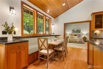 Built-in banquette with  Pocket doors to secondary bedroom.
