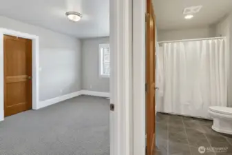 One of two upstairs bedrooms, this one has a walk-in-closet and also opens to the bathroom.